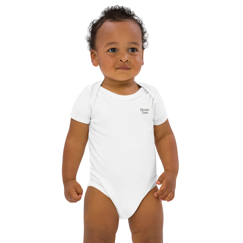 Baby wearing Dream Tone organic cotton bodysuit with short sleeves